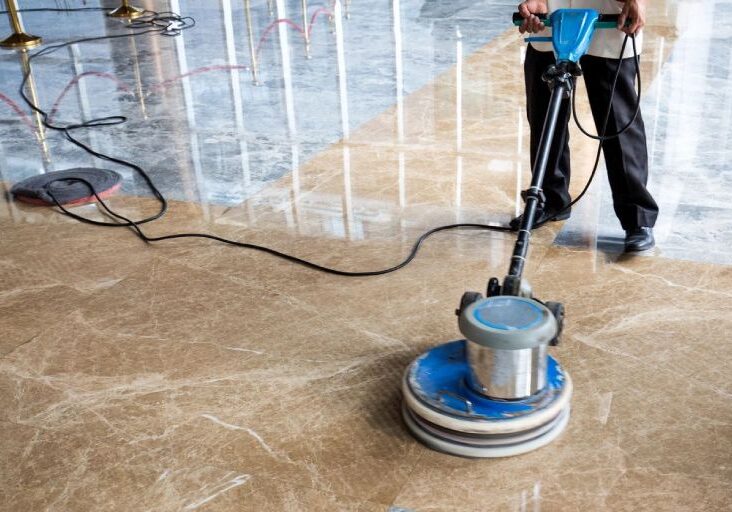 People polishes floor indoors