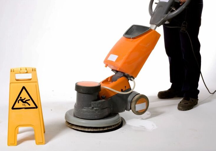 Cleaning the floor with machine